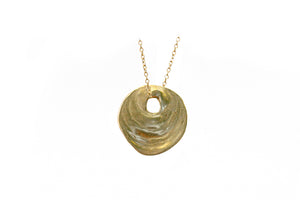 This beautiful pendant’s  natural texture is elegant and inspiring. The pendant measures approximately 10/16 of an inch wide and hangs 3/4 of an from a 16” chain.