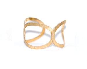 Handmade 3 Ring Cuff in 18K yellow gold plate. This dynamic 18K Gold Plated three ring cuff is sure to be your go to piece for day or night.  With a hammered texture it sits comfortably on your wrist.   Measuring 1 1/2 inches wide.