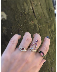 Nora ring shown stacked on hand with other rings