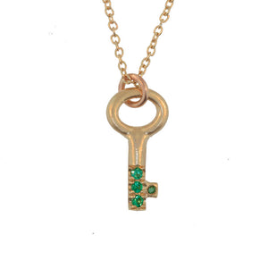 his Key necklace is shown in 14K Yellow Gold with 4 round emeralds in 14K yellow gold.