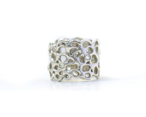 This organic ring measures 9/16 of an inch tall. Set with 10 white diamonds that are 2mm each. (.30TCW) Available in 18K & 14K Gold (Yellow, White, Rose), Silver