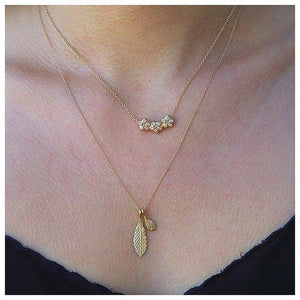 Laura necklace in 14K yellow gold with white diamonds  on neck with other necklace sold separately
