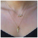 Laura necklace in 14K yellow gold with white diamonds  on neck with other necklace sold separately