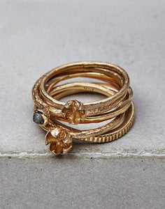 This hand engraved line textured ring is shown in 14K Yellow Gold. The band has an organic wavy feel to it. Perfect on it's own or stacked with other rings. Shown in 14K Yellow Gold and Sterling Silver. 