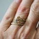 Our Amelia bud rings in 14K yellow gold both large and small shown stacked on finger