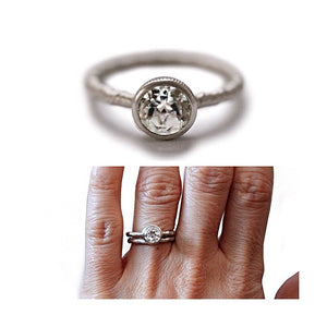 Our Lita ring in 14K white gold with 1ct round white diamond center stone shown On finger