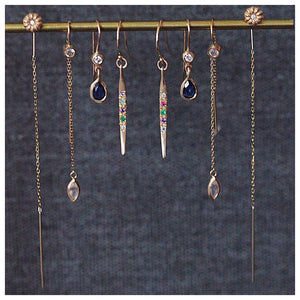 Maura Drop Earrings in 14k yellow gold with blue sapphire and white diamonds shown with other earrings sold separately