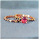 Dot ring in 14K rose gold  It has a black diamond in every other unique textured dot paired with our center stone dot ring.