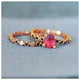 Dot Pink Tourmaline with Black Diamond side stones shown in 14K Rose gold with our Dot stacking ring.