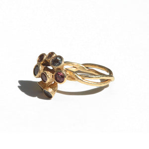Side view of Sapphire Bud Cluster Ring shown in 14K Yellow Gold and is set with 9 beautiful different colored sapphires.