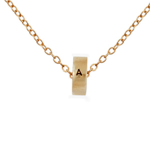 One initial ring shown on chain in 14K yellow gold
