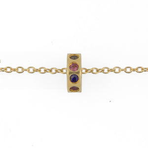 Initial ring necklace shown in 14K yellow gold with multi color stones all around