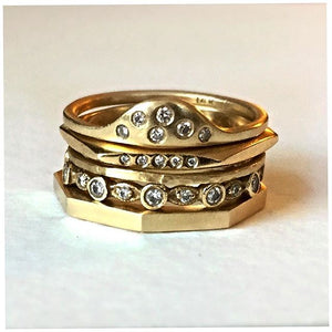 Sun Ring set in 14K yellow gold and white diamonds shown with other rings sold separately