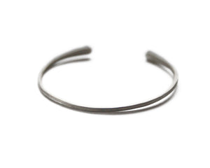 Penelope Cuff Bracelet Available in 14K, 18K or 18K Gold-plated. Our new Penelope Cuff Bracelet is perfect for everyday wear and they are fully adjustable so you can wear them loose or tighter on the wrist.  It measures approximately 2mm wide with rounded ends. Can be ordered in a hammered, plain or Organic Texture.