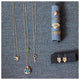 his Key necklace is shown in 14K Yellow Gold with 4 white diamonds  shown with other jewelry all sold separately.